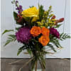 Jar vase, includes mums, roses, alstroemeria, stock , carnations and greens