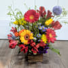 Wood container includes Gerber Daisies, Alstroemeria, thistle, mums, and a variety of
