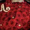 Bouquet of red roses with a jeweled crown and pearl trim