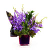 Lovely Vanda orchids and tropical accents in a nice container