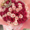Bouquet of pink and hot pink roses with a jeweled crown