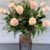 (ALL-ROUND) Soft pale pink roses with white filler and dark greenery in