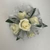 Wrist corsage with silver ribbon/tulle and white baby roses