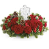 Red rose centerpiece with an angel figurine and pinecones