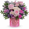 Blush pink roses and clusters of cream spray roses create the romantic