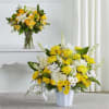 Sunlit yellow lilies and crisp white chrysanthemums combine here to create a