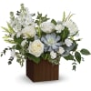White roses and alstroemeria in a wooden cube vase with a succulent