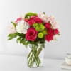 Bouquet of pink and white flowers in a clear glass vase