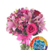 Pink mixed bouquet in a glass vase with a birthday balloon