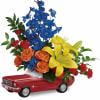 Flowers arranged in a red toy car container