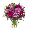 Pink and purple mixed bouquet in a clear glass vase