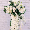 White rose and lily standing spray on an easel