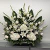 Pure Elegance is a stunning one-sided floral arrangement designed to make a