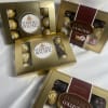 Boxes of Ferrero Rocher chocolates on white fabric