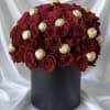 Luxury fresh rose dome elegantly paired with premium chocolate truffles, arranged in