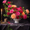 A romantic, garden-inspired floral design featuring premium roses in shades of blush