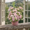 A romantic, garden-inspired floral arrangement featuring delicate blush roses, orchids, and seasonal