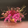 This exquisite arrangement is a symphony of nature's finest, featuring the graceful