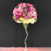 Pink rose bouquet in a tall clear glass vase