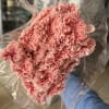 Bouquet of pink carnations wrapped in clear plastic