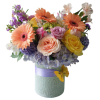 Mixed bouquet in a wrapped vase with peach gerberas, roses, and purple blooms