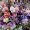 Mixed bouquet of pink, purple, blue, and white flowers