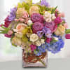 Mixed pastel bouquet in a square glass vase
