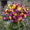 Large bouquet of pink, yellow, and burgundy flowers