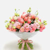 Bouquet of pink and peach tulips with pale pink blooms wrapped in white paper