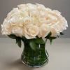 White rose bouquet in a clear glass vase