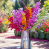 Bright orchid arrangement in a clear glass vase
