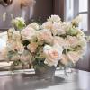 Cream roses and carnations in a gray vase