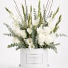 White roses and gladiolus in a white hatbox with eucalyptus
