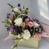 Our Blooming Purses are thoughtfully designed arrangements, blending soft, feminine colors with
