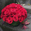 Bouquet of red roses in a glass vase