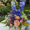 Celebrate with our charming Fluttering Wildflower garden arrangement from Aspen Tower Florist