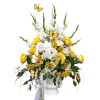 White and yellow floral arrangement in a white vase with butterfly accents