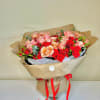 Bouquet of coffee and red roses.