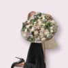 Beautiful and large bouquet of different flowers with the addition of greenery.