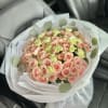 Bouquet of spray pink roses and soft green carnations