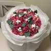 This exquisite bouquet is a true statement of elegance and romance. Featuring