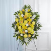 Yellow and white floral standing spray on an easel