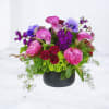 Kiss &amp; Tell is a bold garden-style floral arrangement designed with vibrant