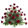 Arrangement of red roses with baby's breath in a white vase