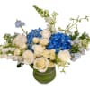 Blue hydrangeas and white roses in a green vase
