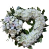 All white 18-inch open heart standing spray with all white flowers, as