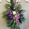 Elegant and expressive, this standing spray showcases a rich palette of purples