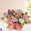 Our charming basket of blooms is an easy, go-to gift for any