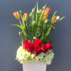 The "Spring Romance Bloom Box" is a charming floral arrangement that brings