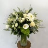 A graceful arrangement that radiates serenity and purity. Featuring a delicate blend